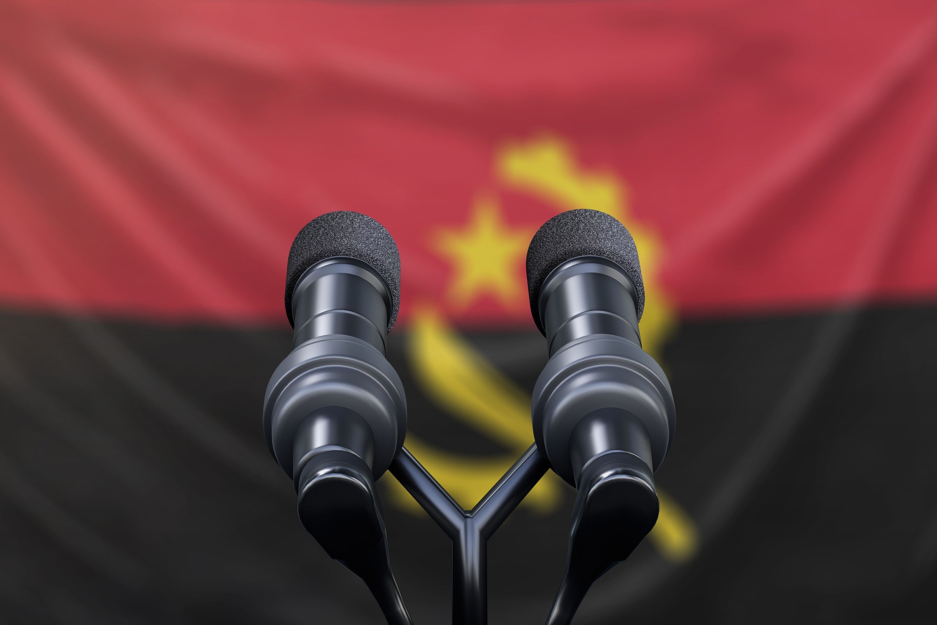 Bandeira de Angola com pódio e microfones